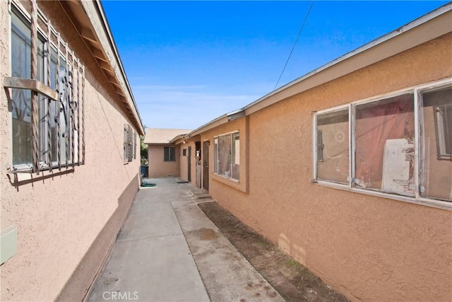 view of side of home featuring a patio area