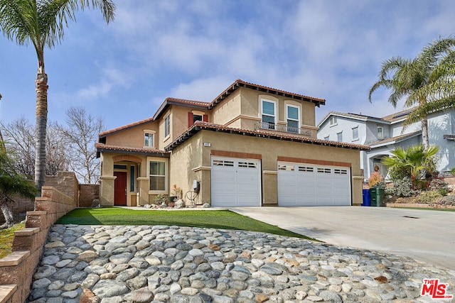 mediterranean / spanish-style house featuring a garage