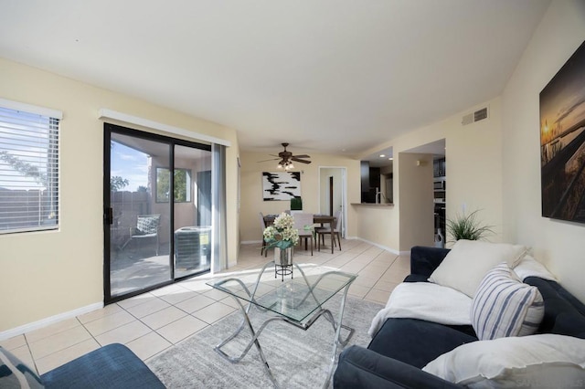 living room featuring light tile patterned flooring and ceiling fan