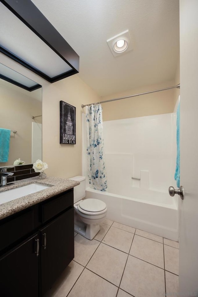 full bathroom featuring vanity, shower / tub combo, tile patterned floors, and toilet