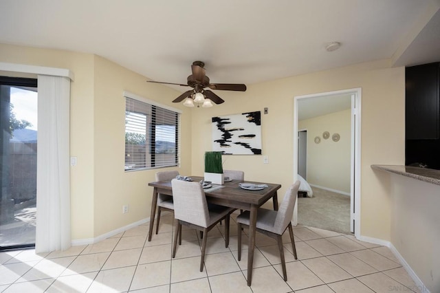 dining room featuring ceiling fan and light tile patterned floors