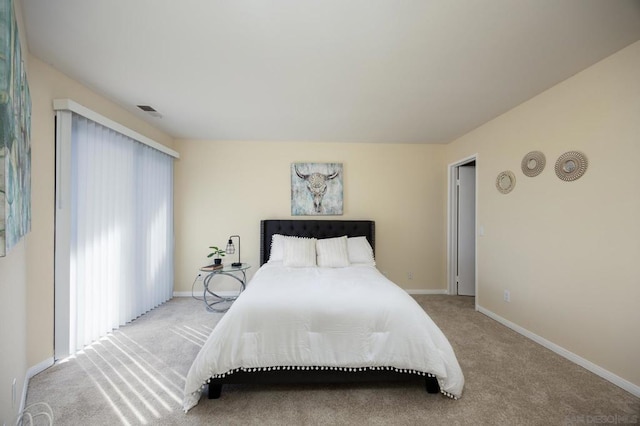 bedroom with light carpet