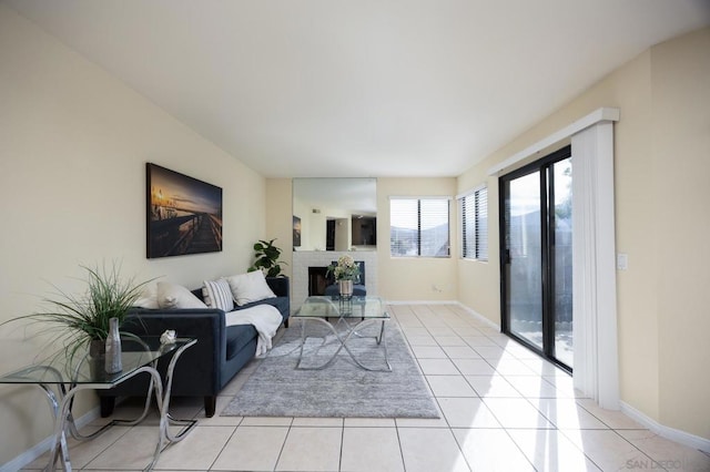 tiled living room featuring a fireplace