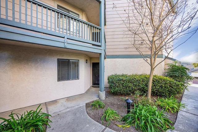 property entrance with a balcony