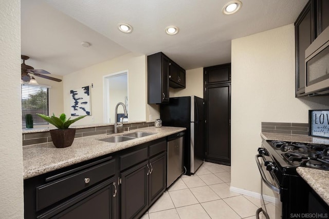 kitchen featuring sink, stainless steel appliances, ceiling fan, and light tile patterned flooring