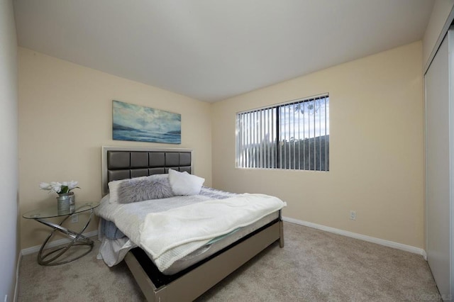 bedroom featuring light colored carpet