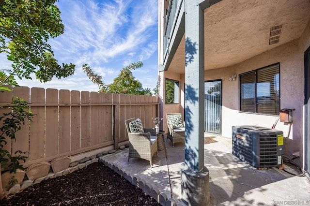 view of patio with central AC