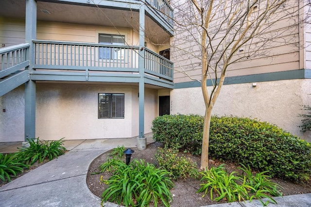 entrance to property with a balcony