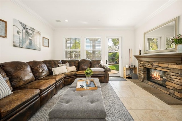 living area with ornamental molding and a fireplace