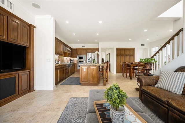 living room featuring recessed lighting, visible vents, stairway, and baseboards