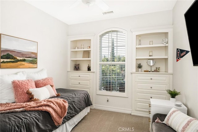 bedroom with light colored carpet, visible vents, and baseboards