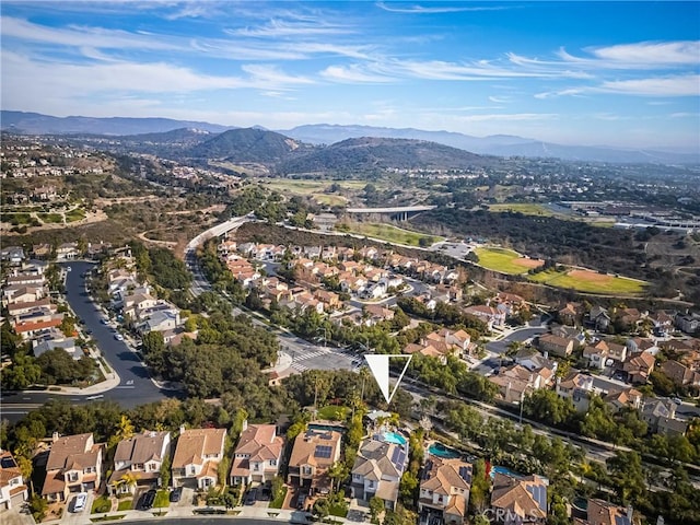 drone / aerial view with a residential view and a mountain view