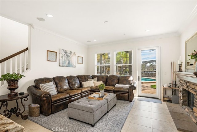 living room featuring light tile patterned floors, stairway, crown molding, a fireplace, and recessed lighting