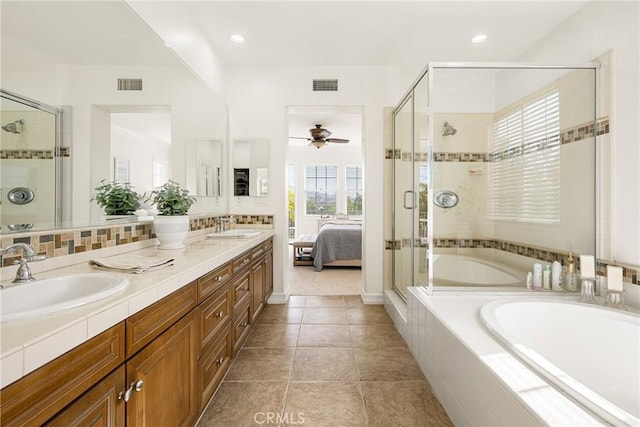 bathroom with visible vents, a sink, and ensuite bathroom