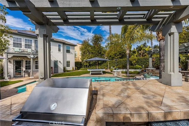 view of patio with a fenced in pool, a grill, a balcony, and a pergola