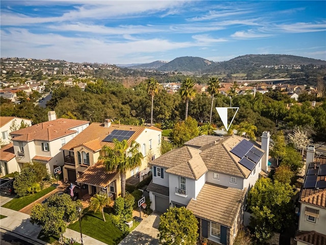 drone / aerial view with a residential view and a mountain view