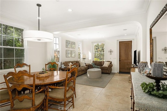 dining space with a baseboard heating unit, ornamental molding, and recessed lighting