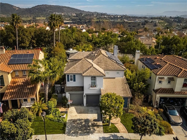 drone / aerial view with a mountain view and a residential view