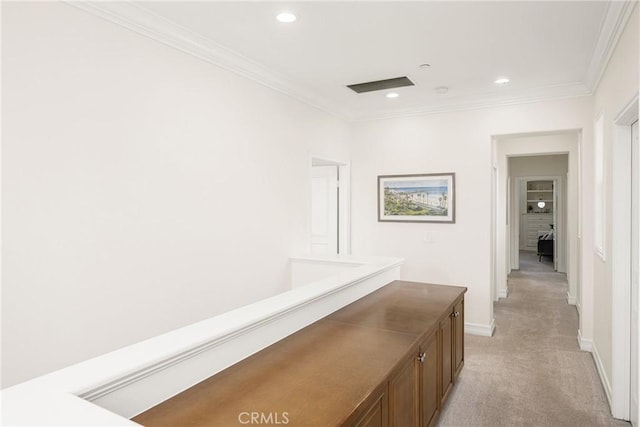 hallway with light carpet, baseboards, visible vents, ornamental molding, and recessed lighting