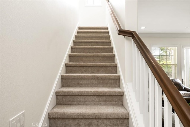 staircase with recessed lighting and crown molding