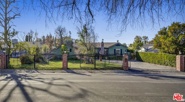 ranch-style home with a front yard