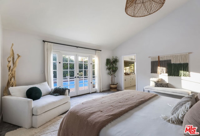 carpeted bedroom featuring access to exterior, high vaulted ceiling, french doors, and ensuite bathroom