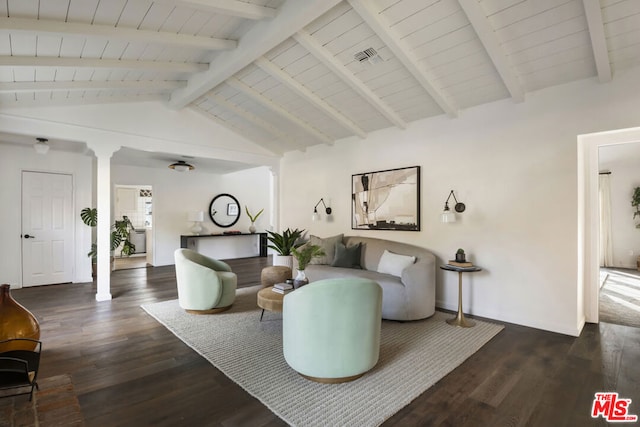 living room with ornate columns, vaulted ceiling with beams, and dark wood-type flooring