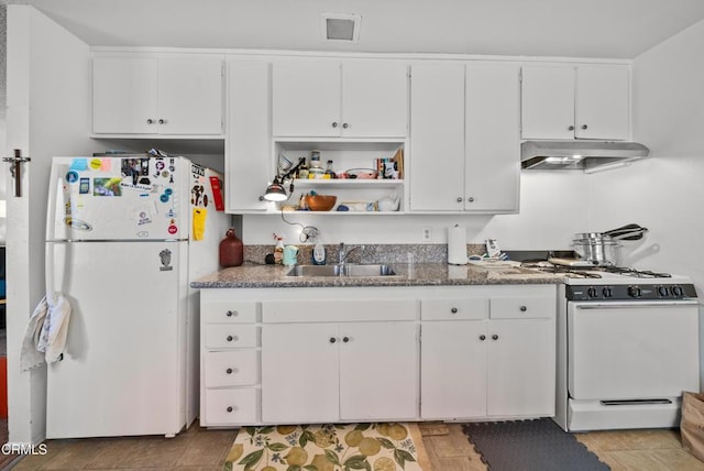 kitchen with white cabinetry, white appliances, sink, and stone counters