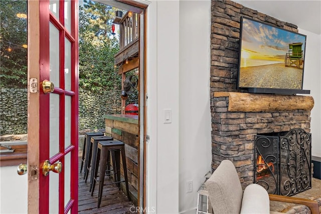 interior space featuring a stone fireplace