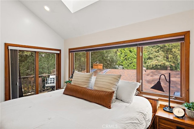 bedroom featuring vaulted ceiling with skylight