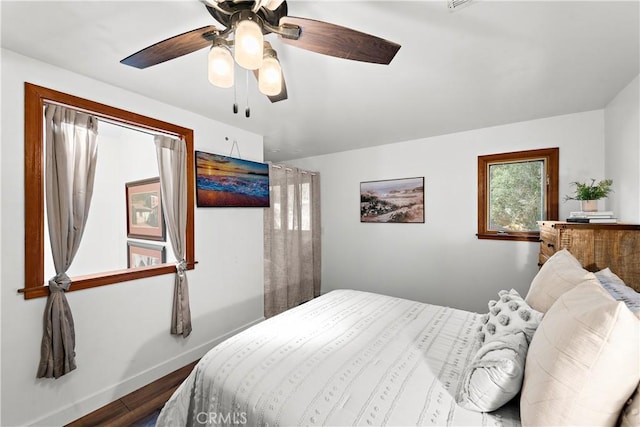 bedroom featuring ceiling fan and hardwood / wood-style floors