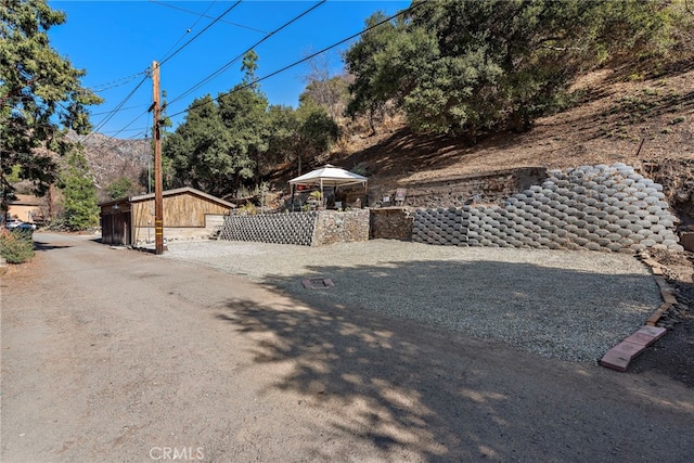 view of property exterior featuring an outdoor structure