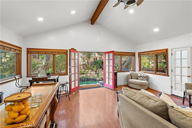 living room with ceiling fan, high vaulted ceiling, french doors, beamed ceiling, and light wood-type flooring