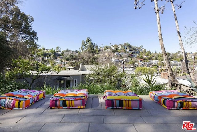 view of property's community with a patio