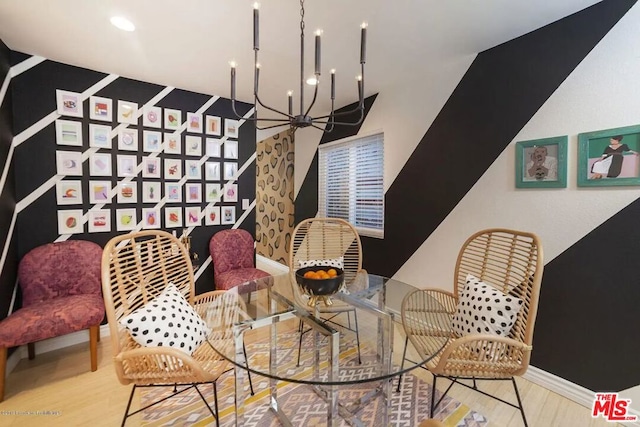 living area featuring a notable chandelier and hardwood / wood-style floors