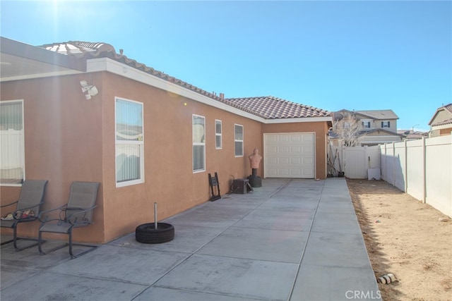 view of side of property featuring a garage