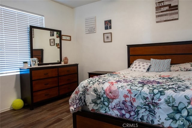 bedroom featuring dark hardwood / wood-style flooring