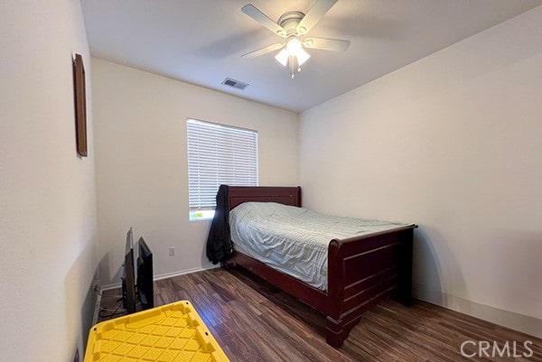 bedroom featuring dark hardwood / wood-style floors and ceiling fan