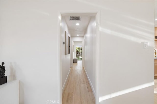 hallway featuring light hardwood / wood-style floors