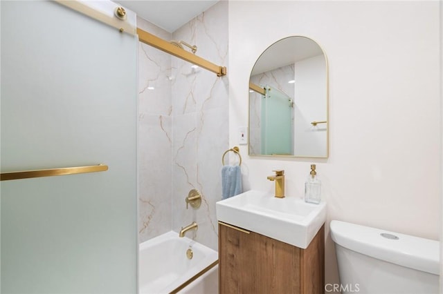 full bathroom with tiled shower / bath combo, vanity, and toilet