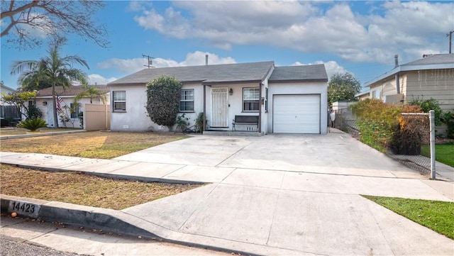 view of front of property with a garage and a front yard