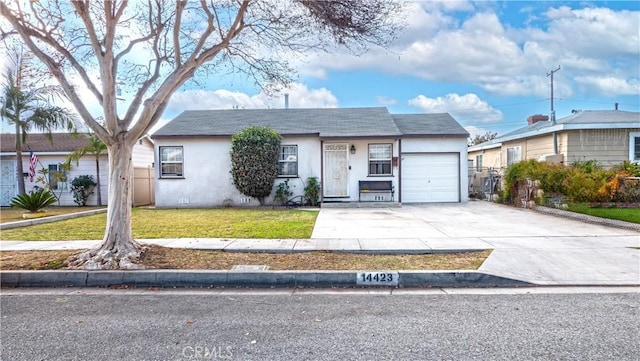 ranch-style home with a garage and a front yard