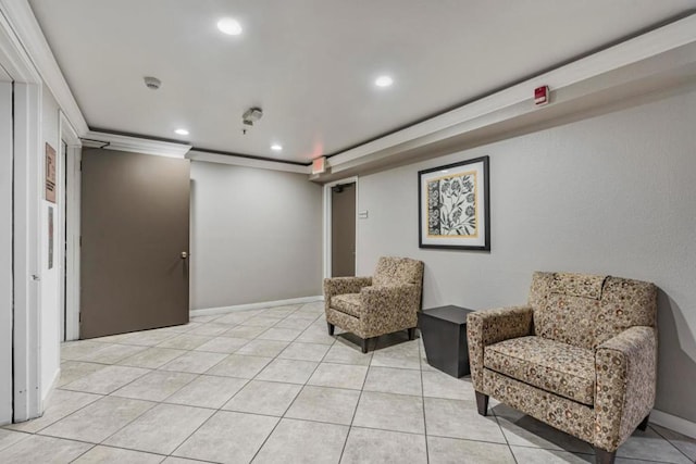 living area with light tile patterned flooring and crown molding