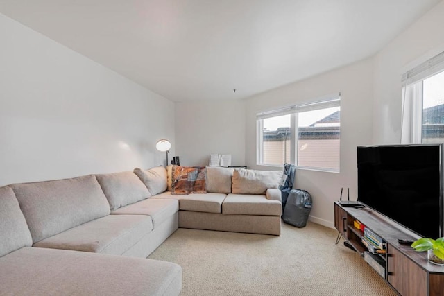 living room with light colored carpet and a healthy amount of sunlight