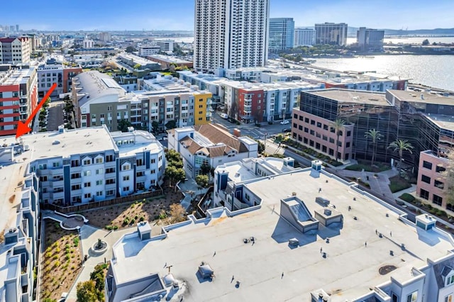 birds eye view of property featuring a water view