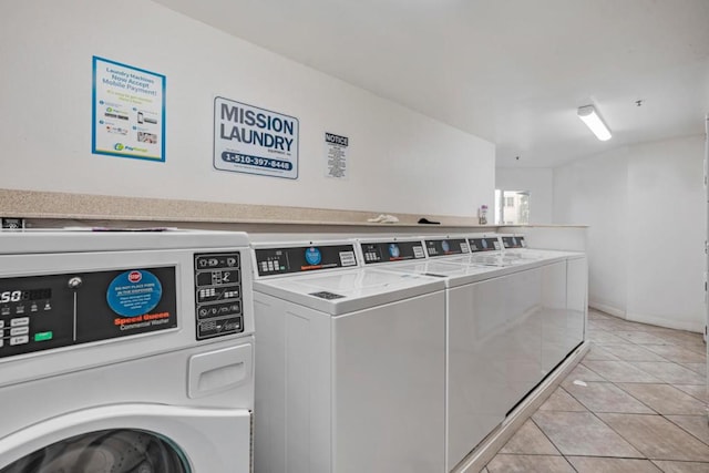 washroom featuring light tile patterned floors and independent washer and dryer