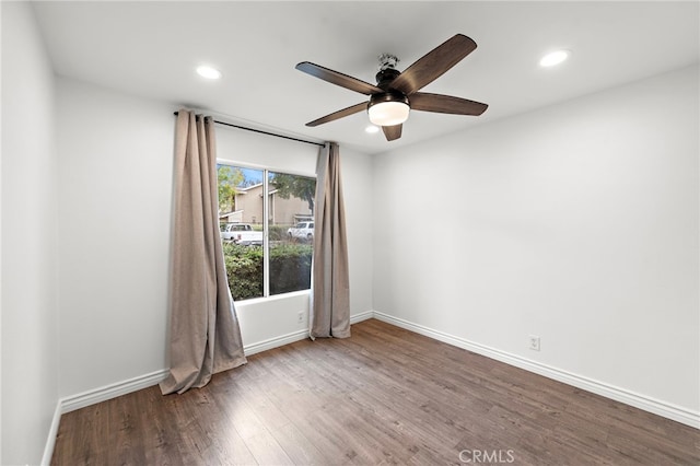 unfurnished room with ceiling fan and wood-type flooring