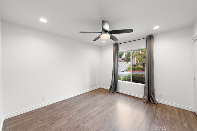 unfurnished room with wood-type flooring and ceiling fan