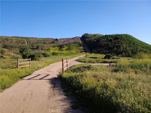 surrounding community with a mountain view and a rural view