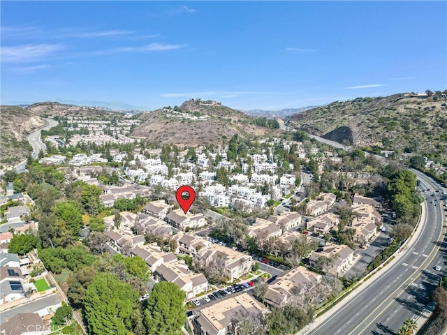 birds eye view of property featuring a mountain view